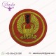 AVG “PEACOCK” PATCH Hand embroidered with gold wire bullion on a red wool felt background