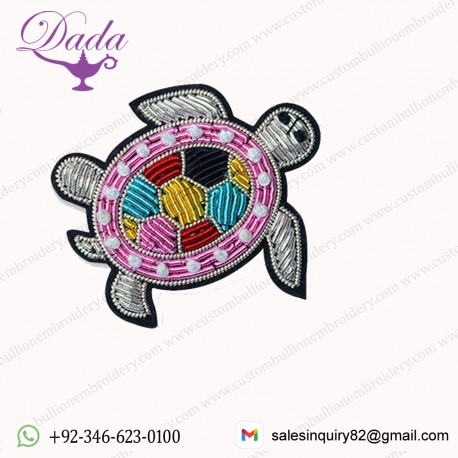 brooch is hand embroidered