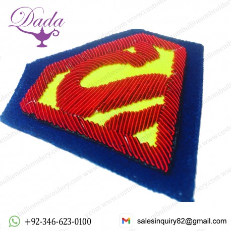 Superman brooch